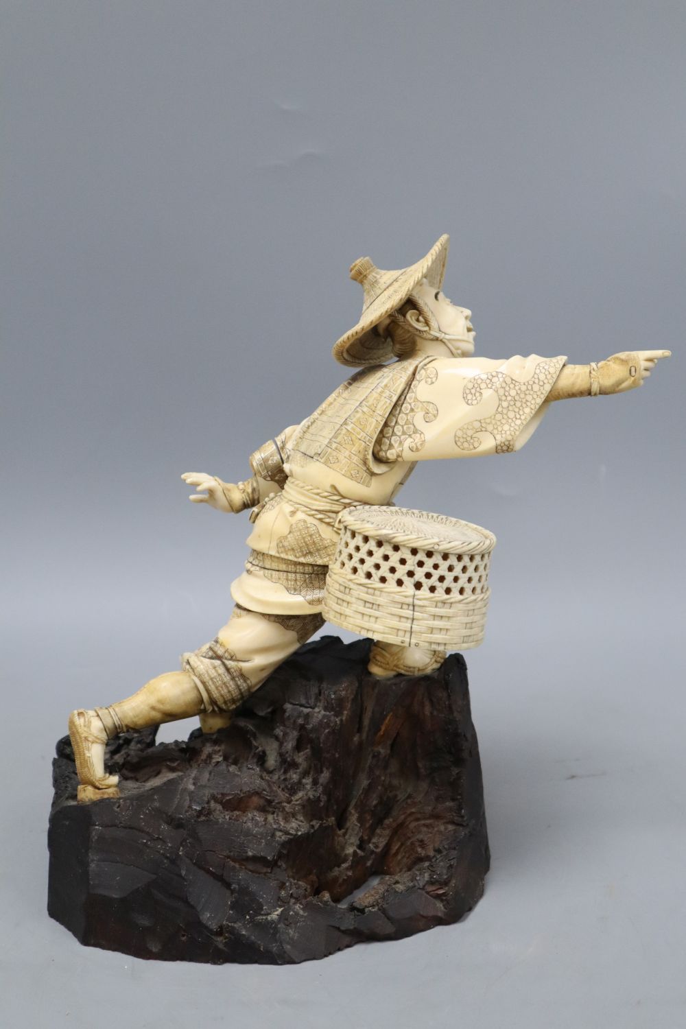 A Japanese Meiji ivory figure of a fisherman, height 26cm